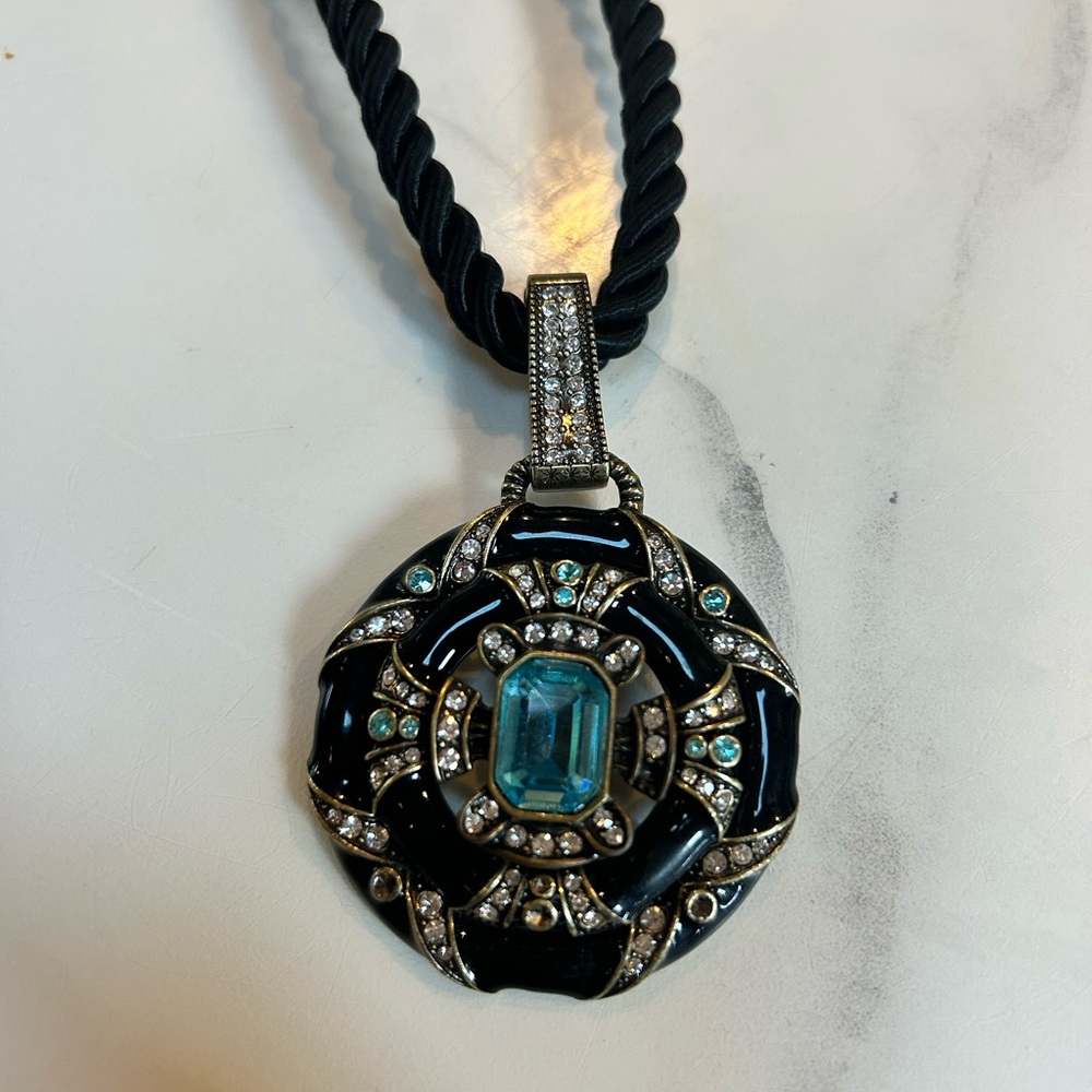 Elegant Black and Silver Pendant with Blue Gemstone